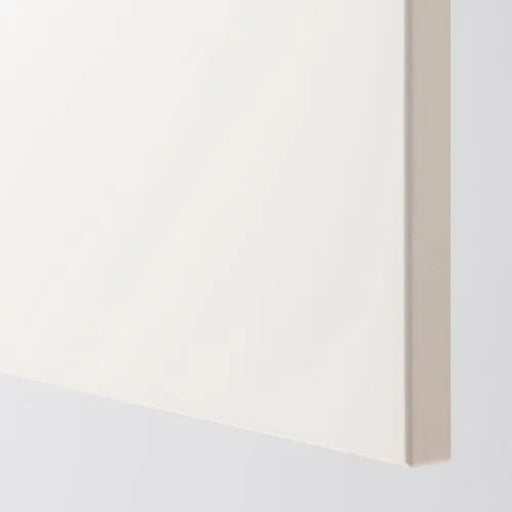 Close-up of a white surface with a beige border on a light gray background