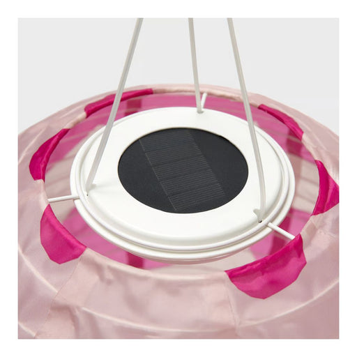 Solar panel with pink and white design on a clear background