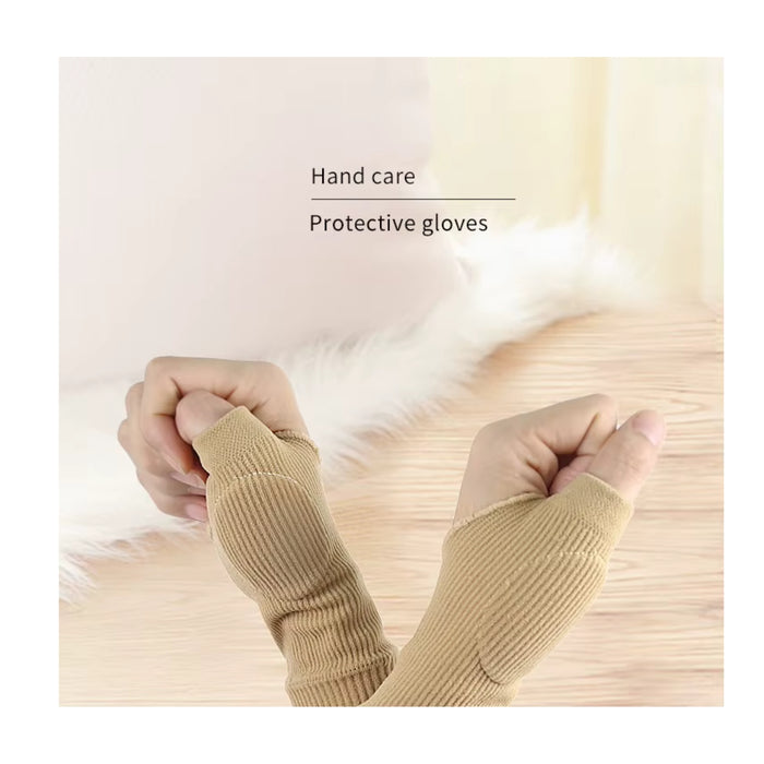 Beige protective gloves being worn on a light background