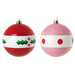 Pair of IKEA VINTERFINT bauble ornaments in red and pink with white bands—one featuring holly leaves and berries, the other with dotted pattern
