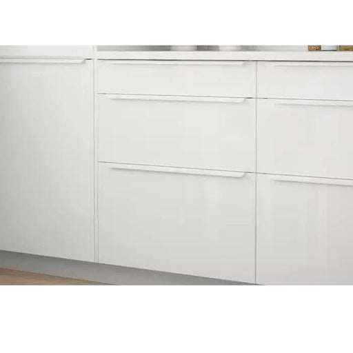 BILLSBRO handle installed on modern white kitchen drawers with integrated horizontal alignment, minimalist aesthetic