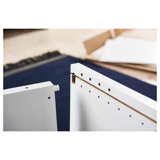 IKEA PLATSA panels being assembled with dowel connectors and pre-drilled holes, highlighting modular flat-pack construction