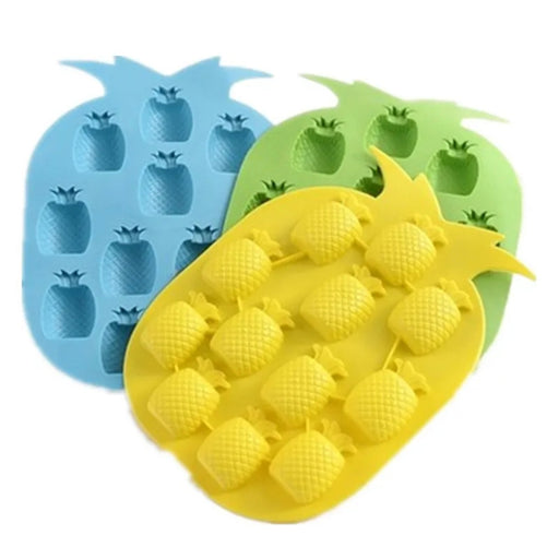 Three pineapple-shaped silicone ice cube trays in blue, green, and yellow on a white background.