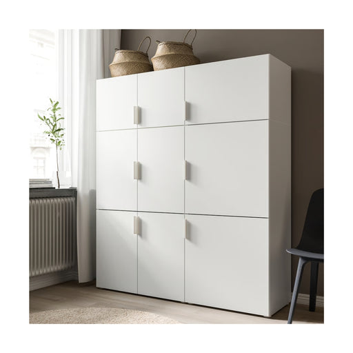 White storage cabinet with multiple doors in a room setting.