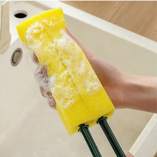 Yellow sponge attached to dual green rods with soap suds – precision cleaning tool for narrow gaps and kitchen fixtures – 1598453485864 13972338