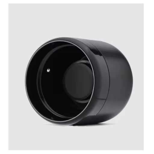 A glossy black cylindrical container or accessory with a wide open top, shown at an angle on a black background.