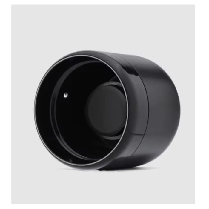 A glossy black cylindrical container or accessory with a wide open top, shown at an angle on a black background.