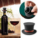 Top hat-shaped silicone stopper inserted in wine bottle neck beside glass – flexible leak-proof seal with whimsical design – 1600002389866 13964736