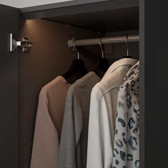 Closet with clothes hanging on a rod, including a leopard print scarf.