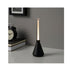  IKEA BJÖRKSPIREA black LED desk light placed next to a clock on a wooden surface
