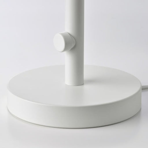 White lamp base on a light gray background