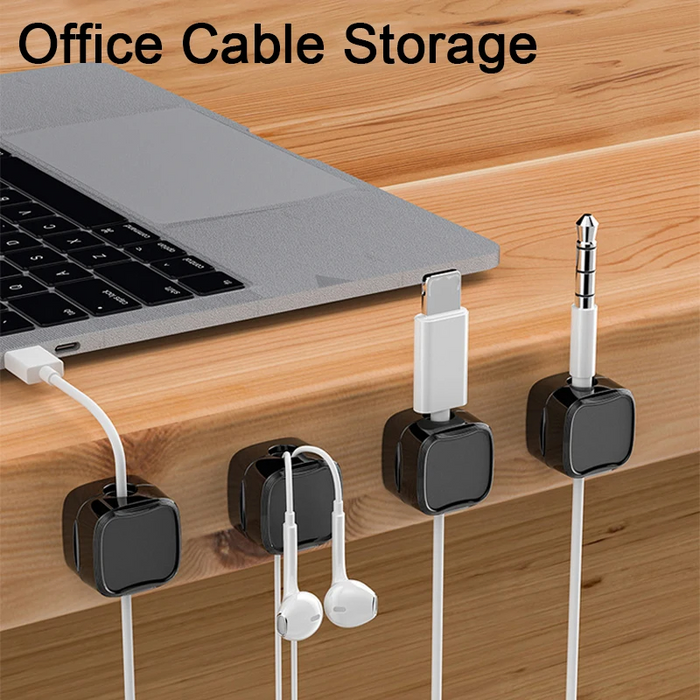 Close-up of single magnetic cord holder gripping USB and power cables