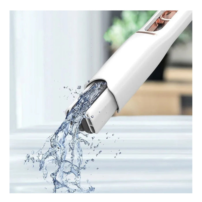 White kitchen faucet with water flowing in a blurred indoor setting