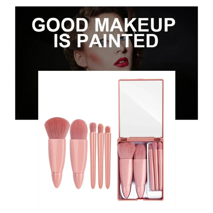 Set of pink makeup brushes with a mirror in a box, featuring the text 'Good Makeup is Painted' on a black background.