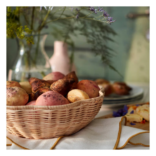 Basket of potatoes on a table with decorative elements