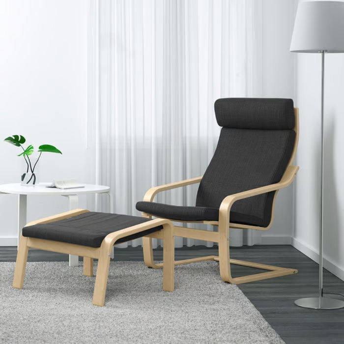 IKEA POÄNG armchair with Hillared anthracite cushion and birch veneer frame, paired with footstool; styled in modern room with white table and floor lamp – 60362507, 30158659
