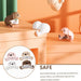 Set of four animal-shaped silicone baby corner guards in pastel tones—pink, beige, white, and brown—each attached to the sharp corners of different furniture pieces. Their soft, rounded forms resemble adorable cartoon animals, offering both safety and decorative charm. Caption reads: “SAFE – Reasonable design, can provide excellent protection effect, can effectively improve the safety of baby activities” -1600001888980 13025258.