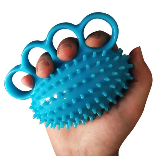 Blue textured ball with handles held in a hand against a white background