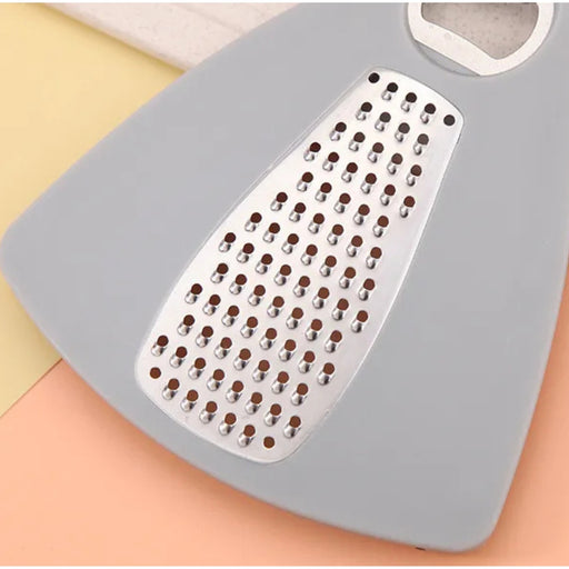 Gray grater with metal surface on a colorful background