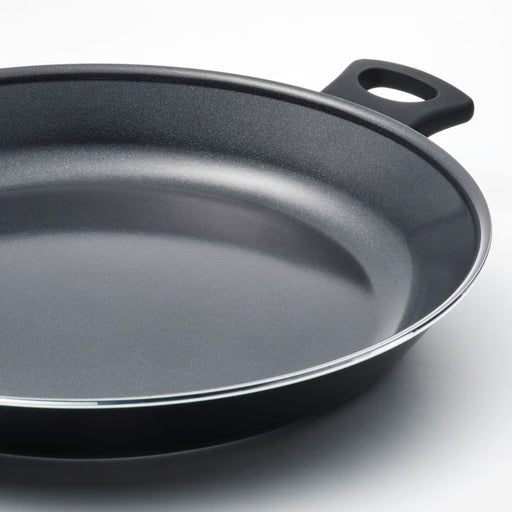 Black frying pan on a white background