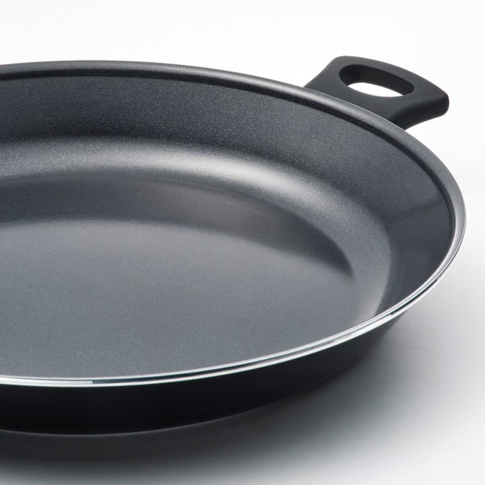 Black frying pan on a white background