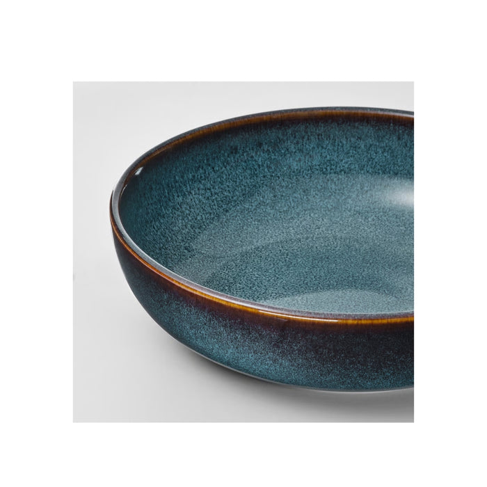 Blue ceramic bowl on a white background