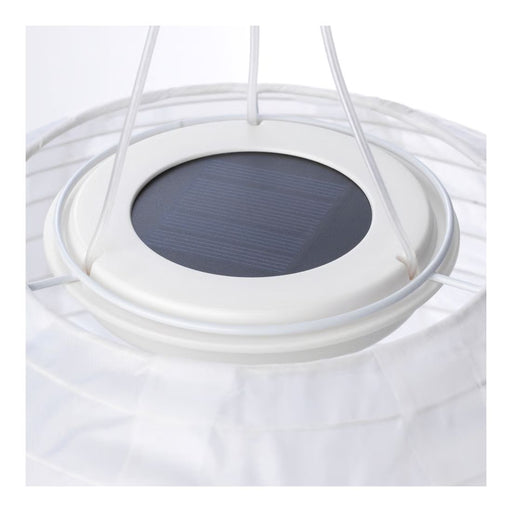 Close-up of a solar panel embedded in a white circular structure on a white background