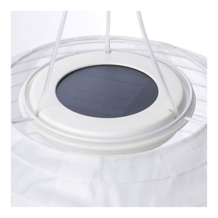 Close-up of a solar panel embedded in a white circular structure on a white background