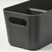 Black storage bin with a handle on a white background