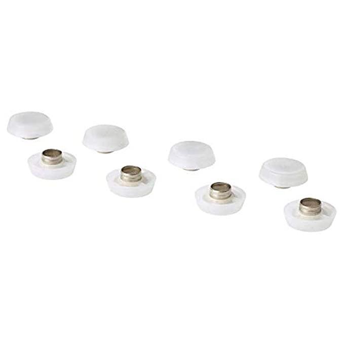 Set of white cabinet knobs with metal inserts on a white background