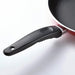 Close-up of a frying pan with a black handle on a white background