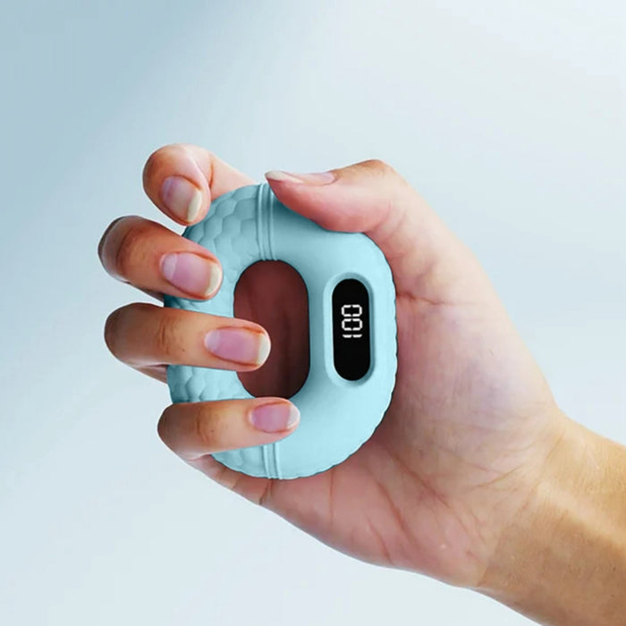Hand holding a light blue digital grip strength trainer against a light gray background