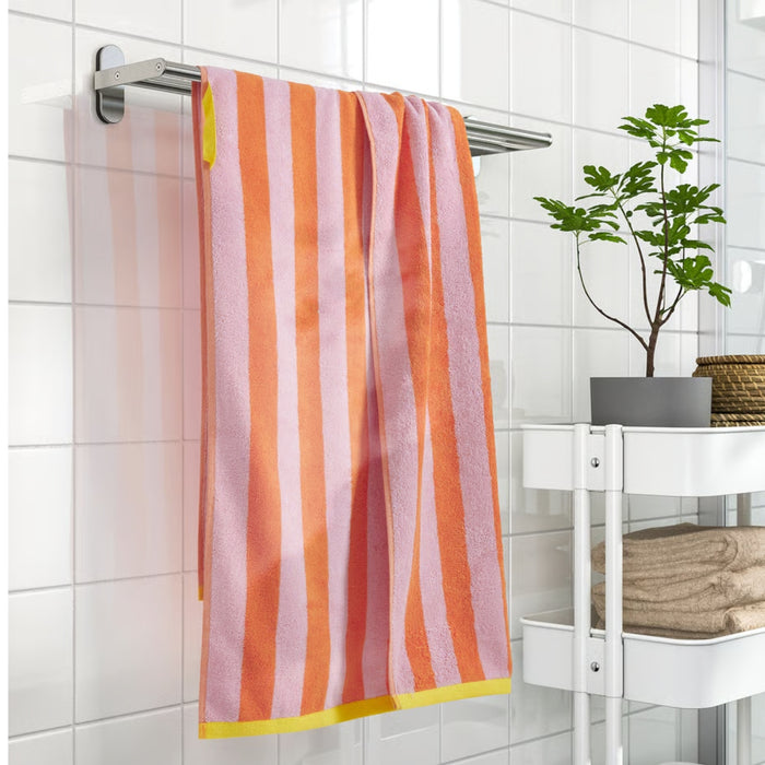 Soft cotton SLÅNHÖSTMAL towel in vibrant orange and pink, 70x140 cm