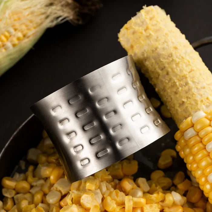 Kitchen corn thresher peeling fresh corn kernels quickly and efficiently.