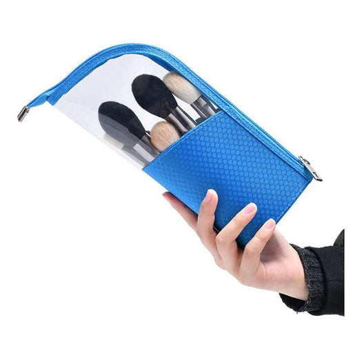 Blue makeup brush pouch held by a hand with brushes inside on a white background