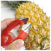 Pineapple peeler being used on a pineapple
