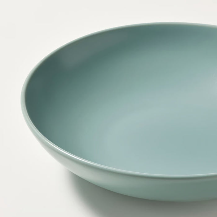 Light blue ceramic bowl on a white background