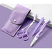 Eyebrow grooming kit purple pouch scissors tweezers razor displayed on purple surface
