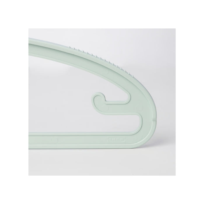 Light green plastic hook on a white background