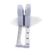 Foldable measuring tape with white casing on a white background