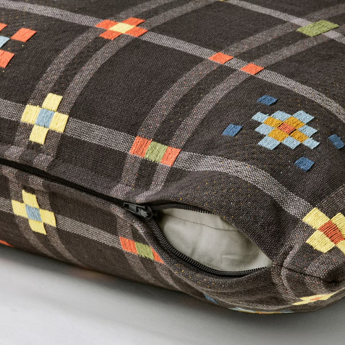 Textured pillow with geometric pattern on a neutral background