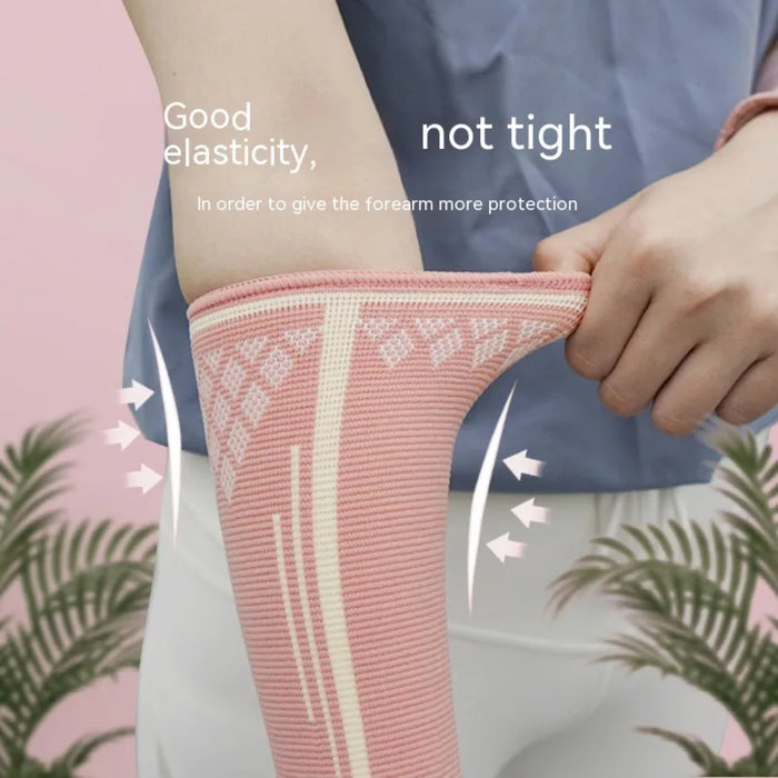 Pink volleyball arm guard shown stretched by hand – highlights elasticity and forearm protection – 1600002527315