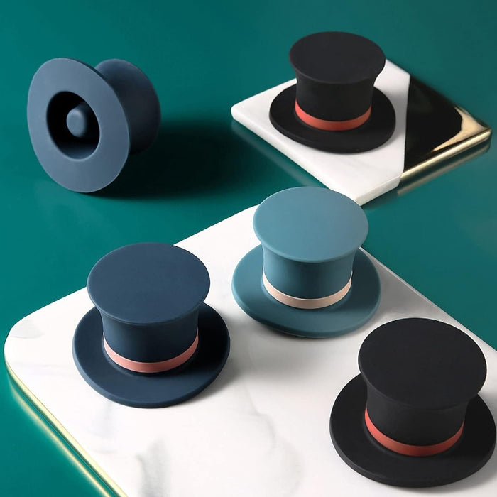 Collection of top hat-shaped silicone accessories in black, blue, and navy with red/pink bands – shown supporting smartphone on glossy surface – 1600002389866 13964736