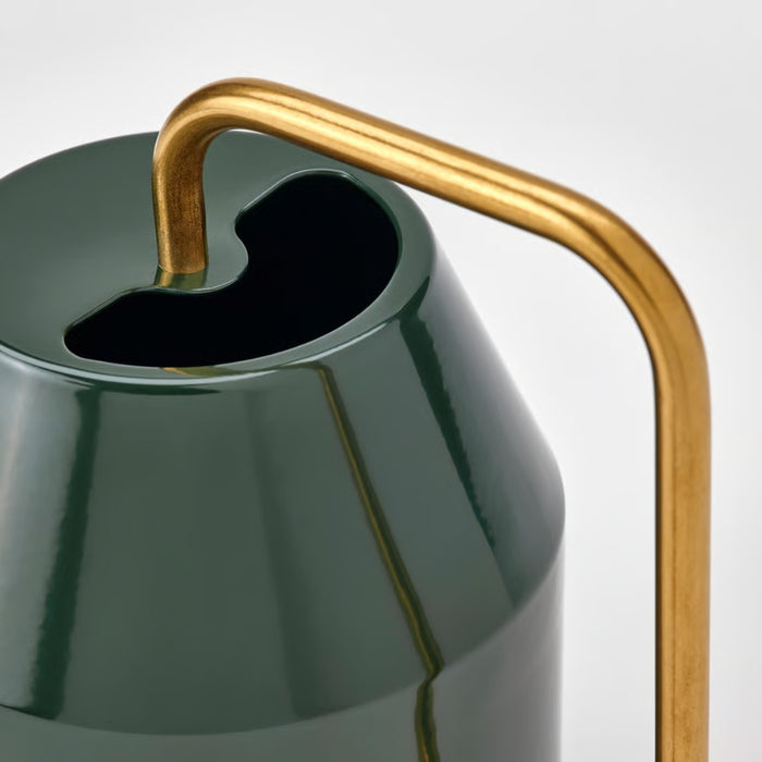 Close-up of VATTENKRASSE watering can showing conical body, irregular top opening, and angular gold handle detail