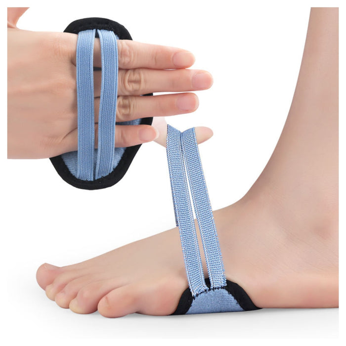Person wearing a blue foot strap on a white background
