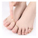 Beige toe separators on feet against a white background