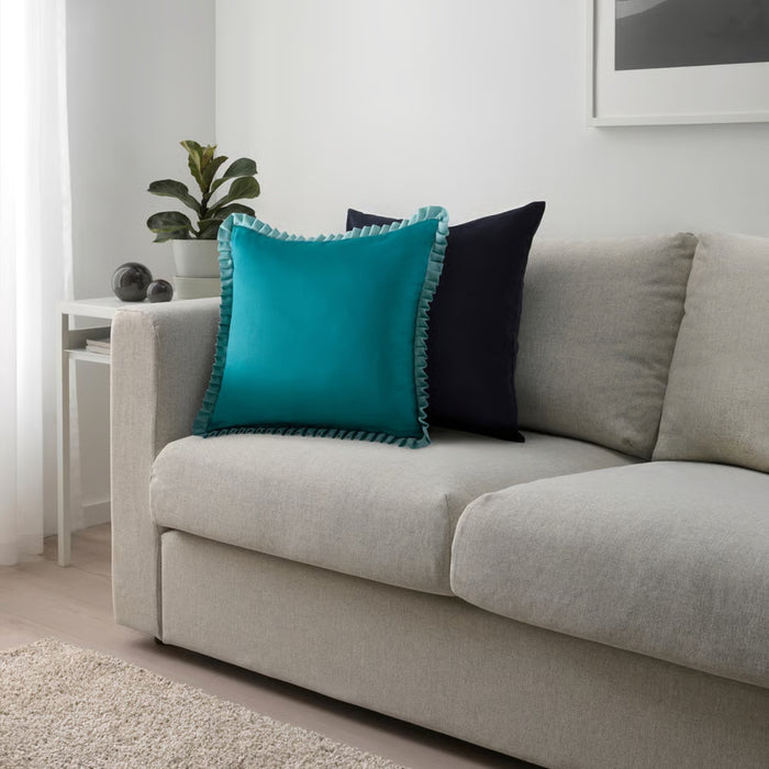 IKEA GOKVÄLLÅ Cushion cover, blue, 50x50 cm – teal ruffled pillow on light gray sofa with navy accent and modern décor – 60596120
