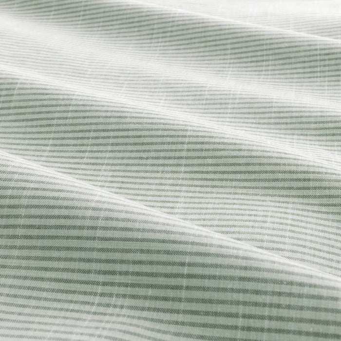 Close-up of fabric with thin green stripes on a white background