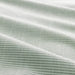 Close-up of fabric with thin green stripes on a white background
