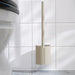 IKEA FLORSJÖN Toilet brush, beige, placed in bathroom corner with white tiles and gray floor - 50604861